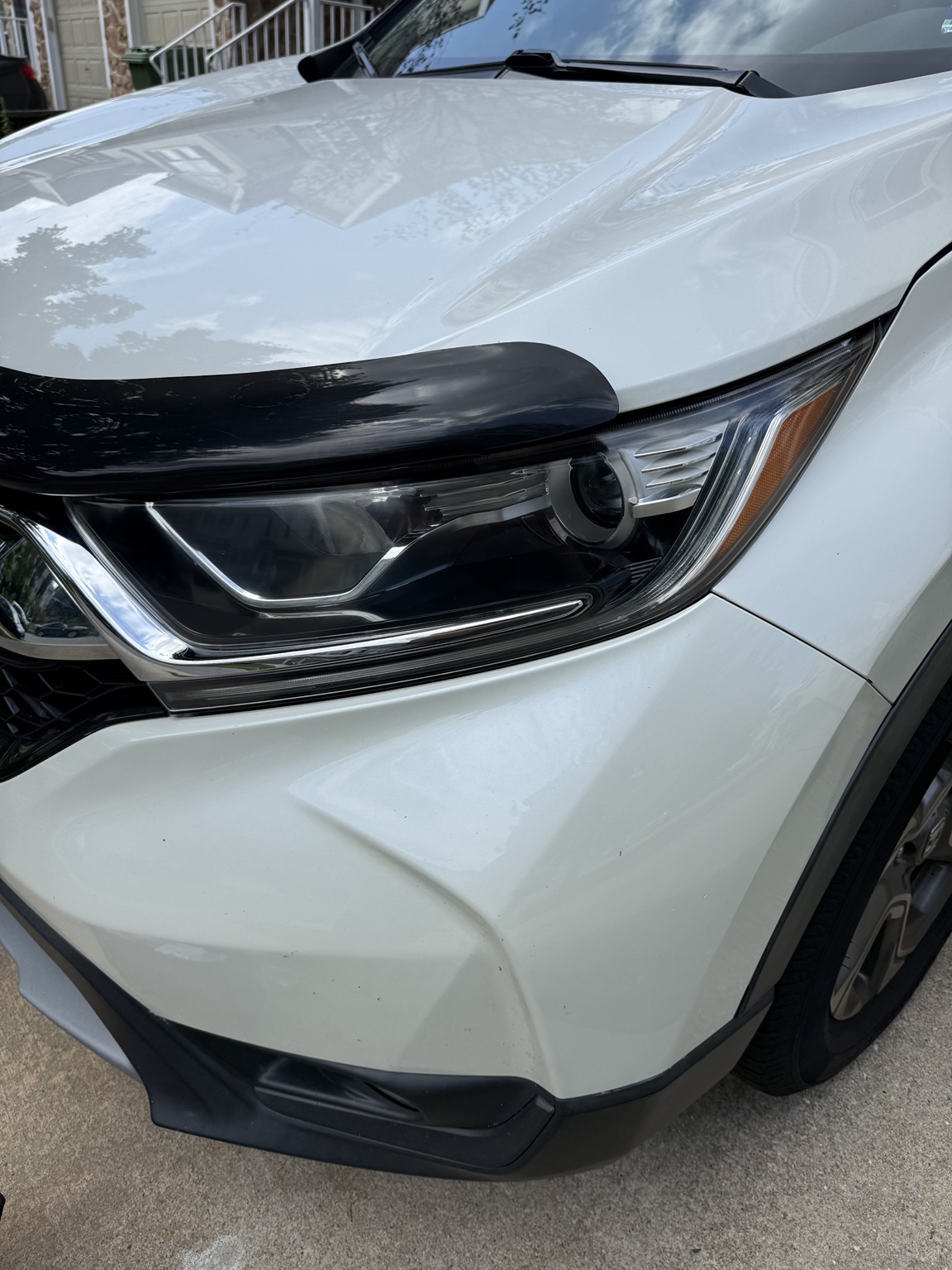 Restored headlight on the same white SUV